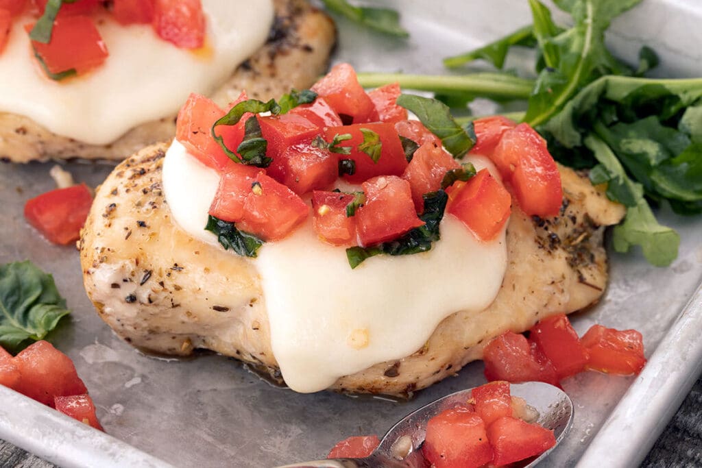 Margherita Chicken on a baking sheet.