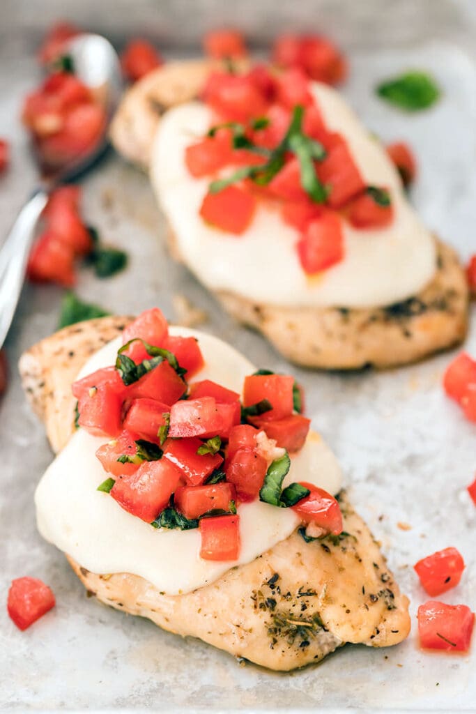Chicken Margherita on a baking sheet.