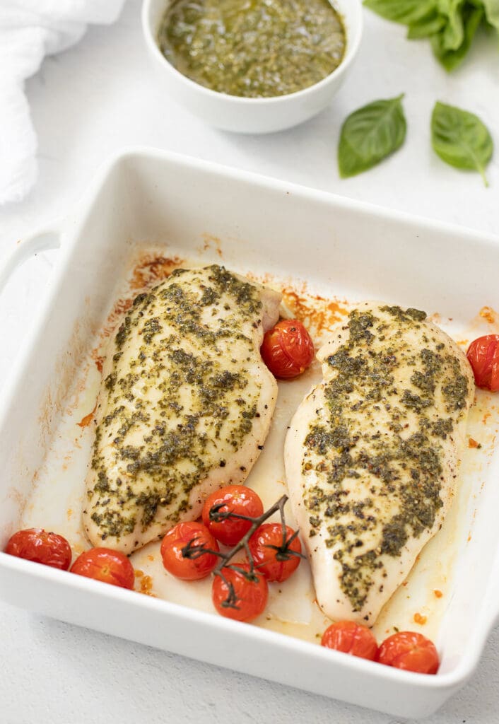 Baked Pesto Chicken in a white dish.