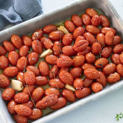Tomato Confit on a silver baking sheet.