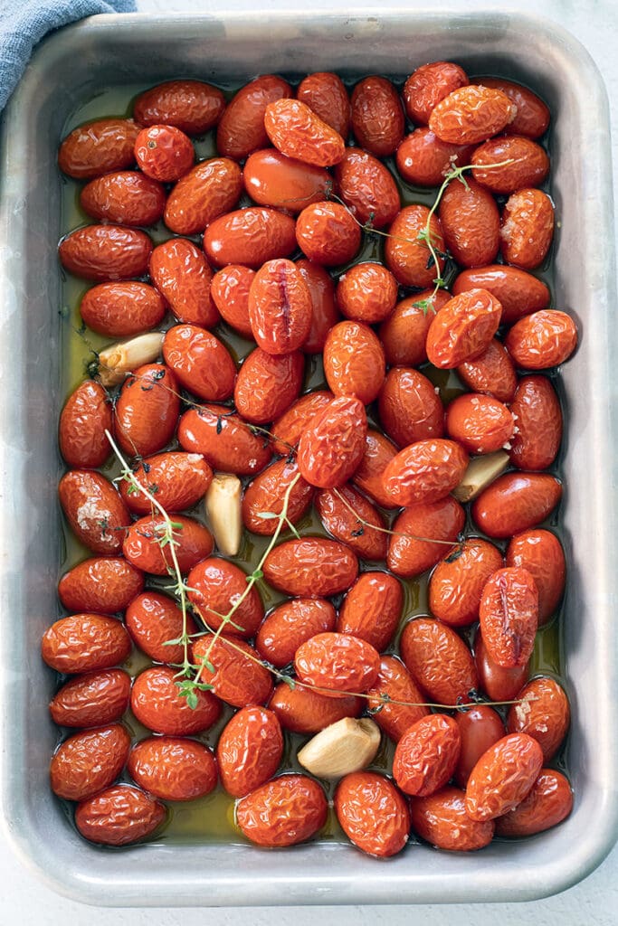 Confited tomatoes on a baking sheet.