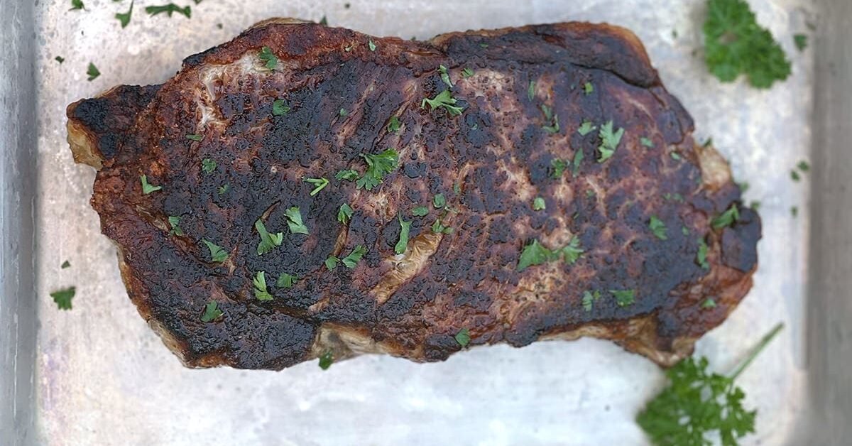 Blackstone Steak on a silver baking sheet.