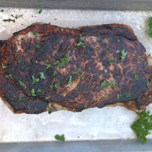 Blackstone Steak on a silver baking sheet.