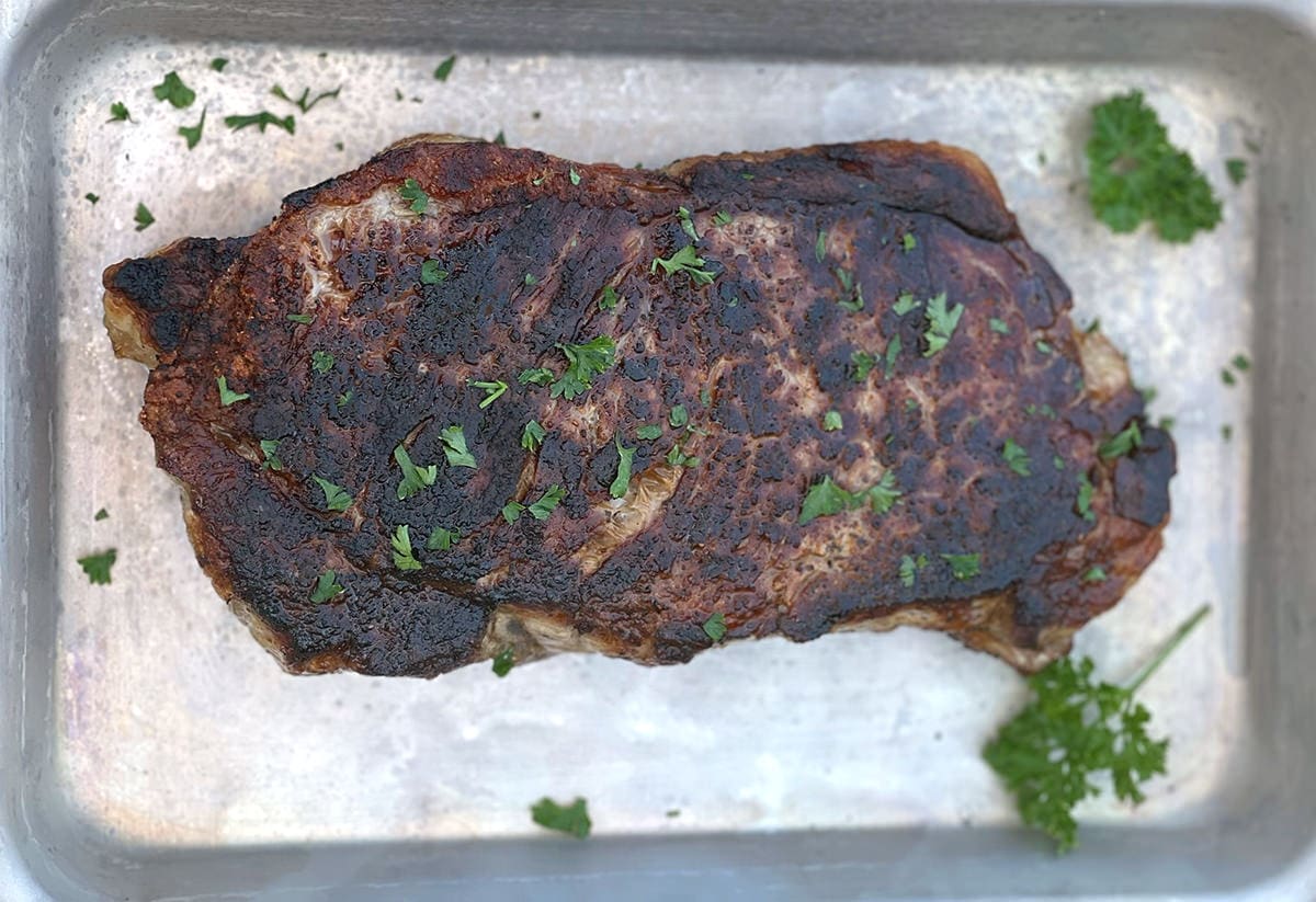 Blackstone Steak on a silver baking sheet.