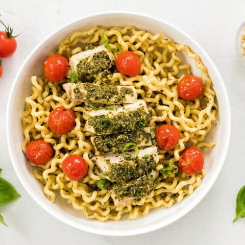 White bowl of pasta al pesto.