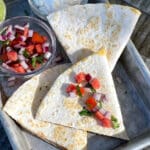 Blackstone Quesadilla topped with pico de gallo.